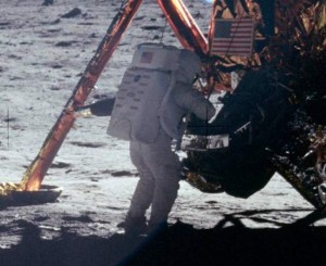 Neil Armstrong placing US flag on the moon