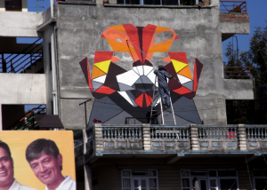 DAAS painting the Red Panda mural at Bagmati Bridge in Kathmandu Photo by Alok Serizawa Bastakoti
