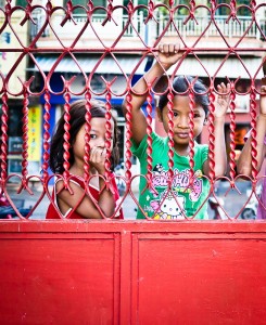 Street Photography in Phnom Penh, Cambodia by Tim Kelsall - children outside the Teochiu Temple