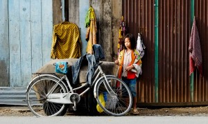 Street Photography in Phnom Penh, Cambodia by Tim Kelsall - girl with a bicycle